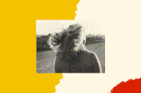 A black-and-white photo of the back of a woman's head is in the center of the page. Her light-colored hair is blowing in the wind, and she is walking across a field.