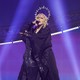 Madonna dressed in black robes with light beams framing her