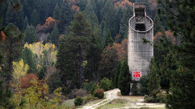 The site of an abandoned mine near Grass Valley, California, is marked by a weathered concrete silo.