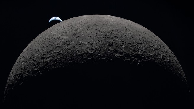 Earth rising above the moon