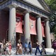 A campus tour walks through the Harvard campus. 
