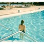 A woman standing in a pool