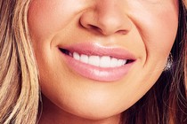 Bottom half of a smiling woman's face