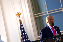 President Trump talking emphatically into a microphone