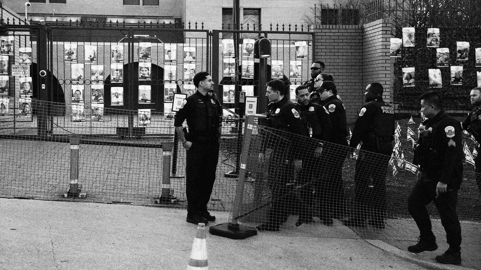 Police near a vigil for Aaron Bushnell