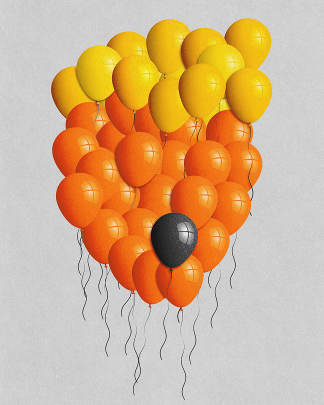 A cluster of yellow and orange balloons configured to look like Donald Trump, with one black balloon floating among them.