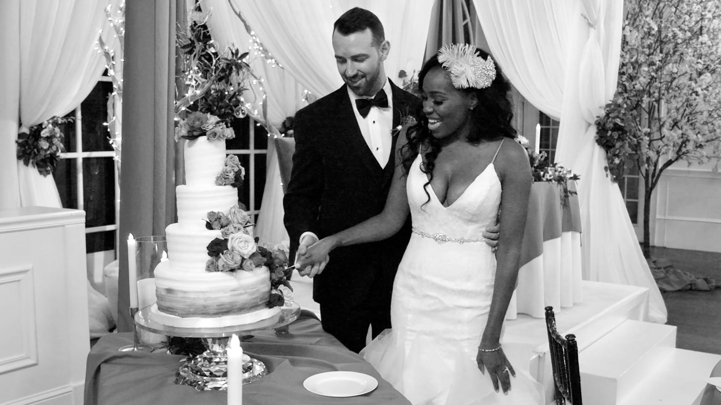 Lauren and Cameron cut the cake during their wedding on Season 1 of "Love Is Blind"