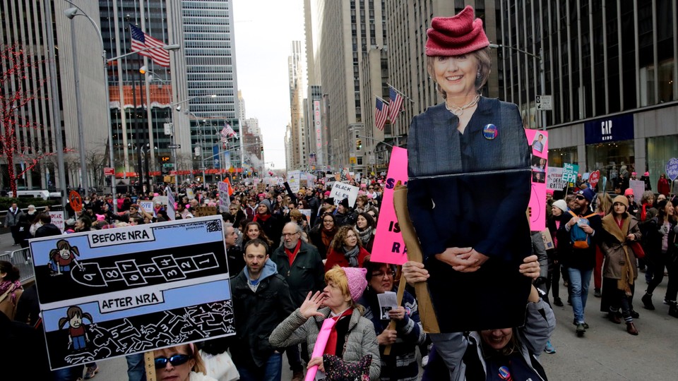 People carrying a poster of Hillary Clinton take part in the Women's March in Manhattan in New York City, New York, U.S., January 20, 2018