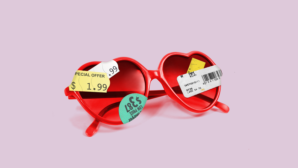Red heart-shaped sunglasses affixed with price-tag stickers