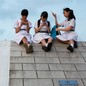 Photograph of young girls in China using their smartphones