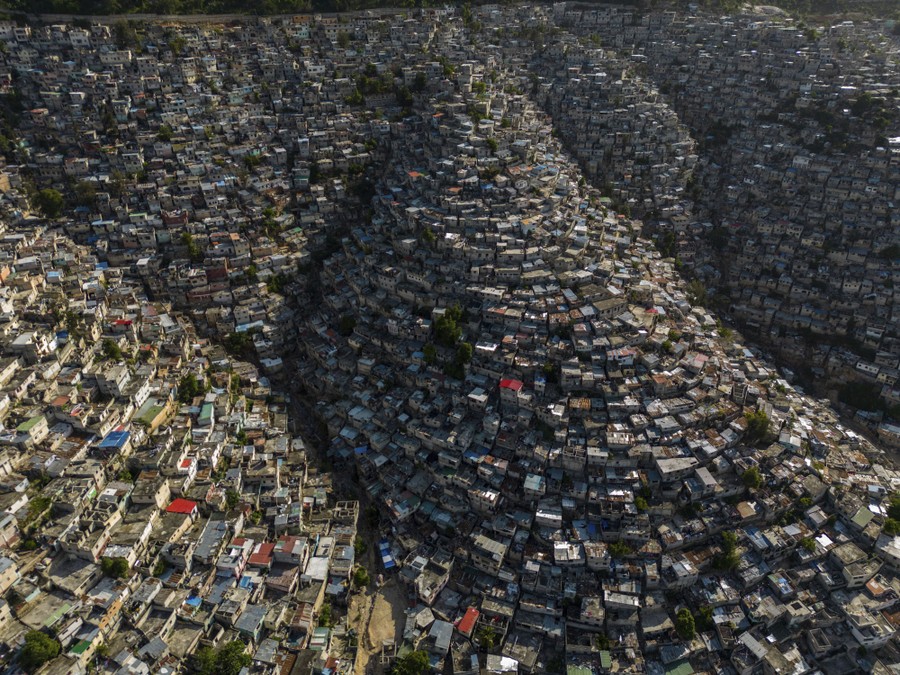 An aerial view of steep-sloped hillsides covered in small houses