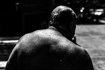 An older man, Pablo Miranda, sweats in the high heat in Portland.