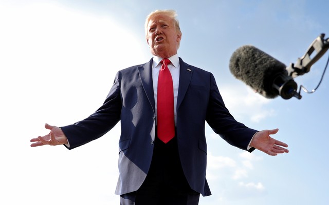 A photo of Donald Trump speaking in front of a boom microphone