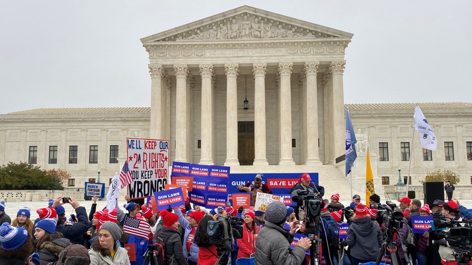 Supporters of gun-control laws rally in front of the Supreme Court.
