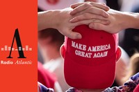 person with his hands on his head, wearing a red MAGA cap