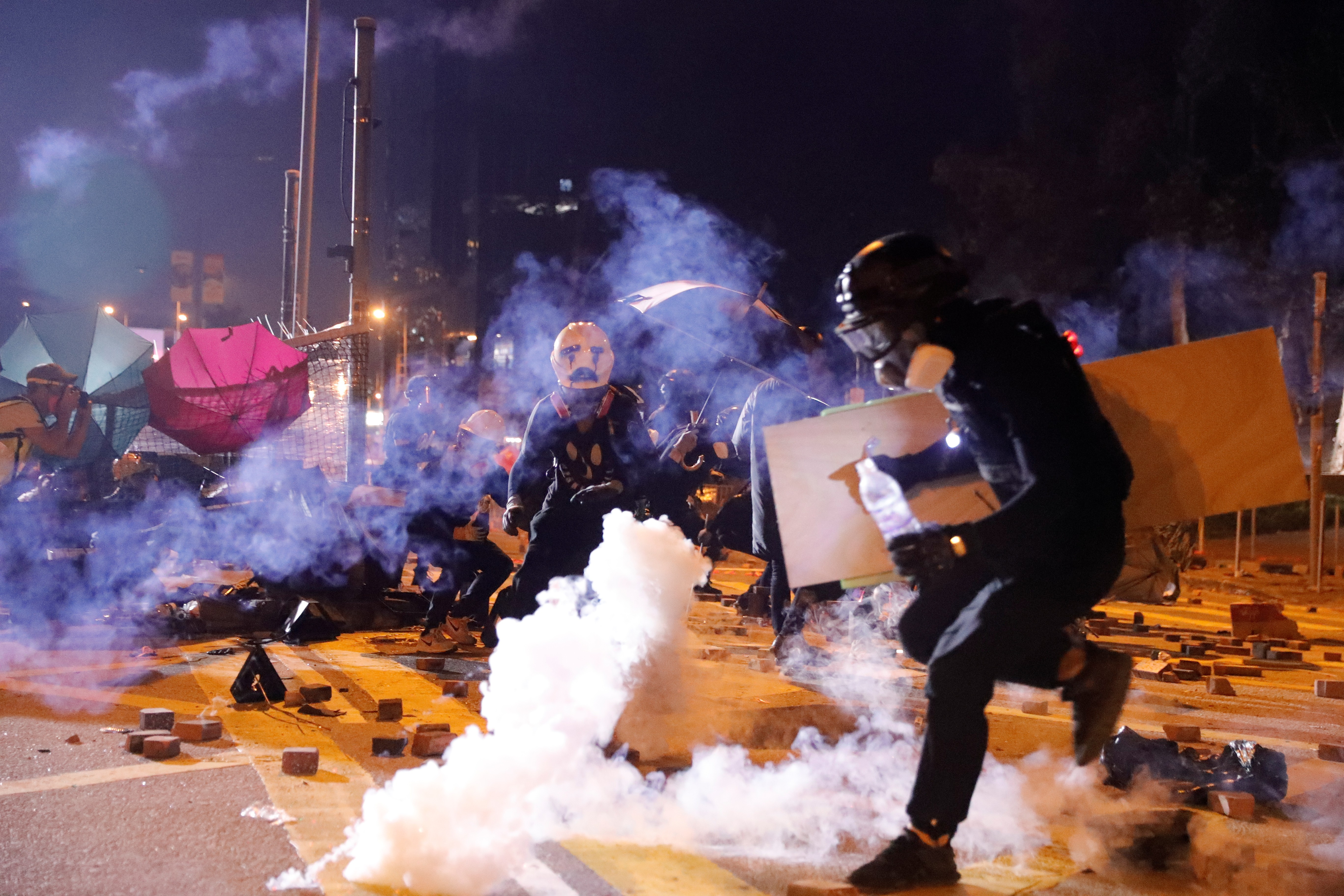 Anti-government protesters clash with police outside the Polytechnic University in Hong Kong.