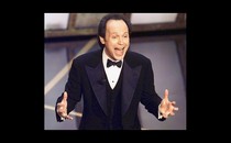 Billy Crystal onstage at the Oscars