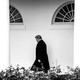 President Trump walks in front of the White House.