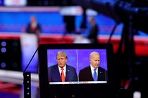 A monitor shows Trump and Biden during the first 2024 presidential debate