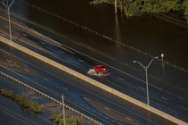 A car drives through flood waters along Interstate 95 after Hurricane Matthew hit Lumberton, North Carolina. 