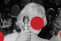 A woman in a dress with her face covered by a red circle