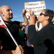 A protester and counter-protester face off at a Trump rally.