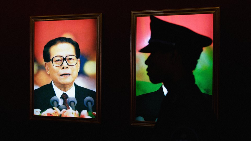 An image of Jiang Zemin and a silhouette of a PLA soldier