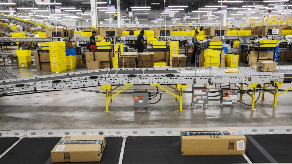 Workers at an Amazon f​ulfillment center in Staten Is​land