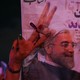 A supporter of Iranian president Hassan Rouhani holds his poster as she celebrates his victory in the presidential election, in Tehran, Iran, on May 20, 2017.