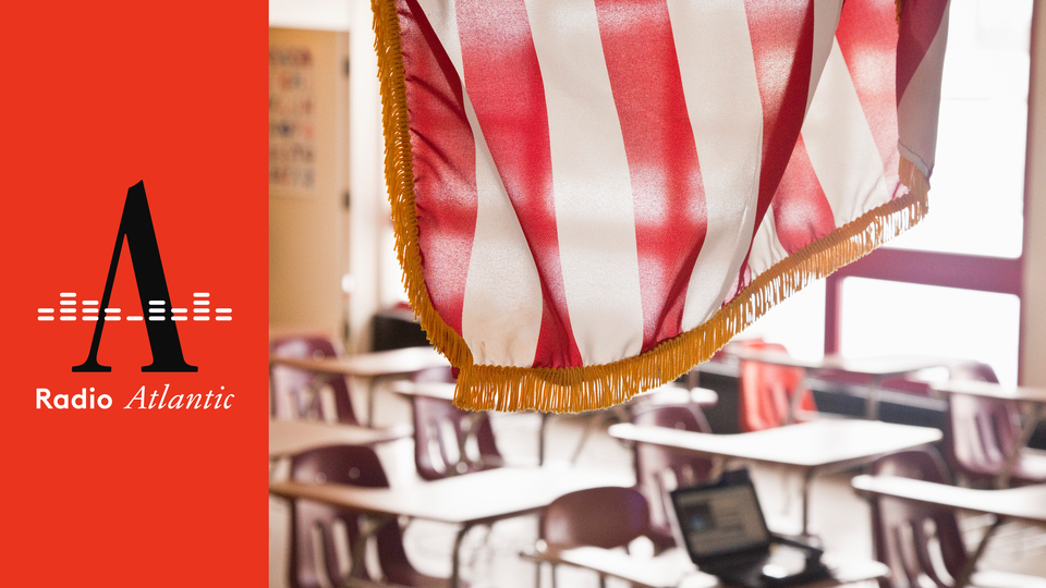 An American flag hanging in a classroom