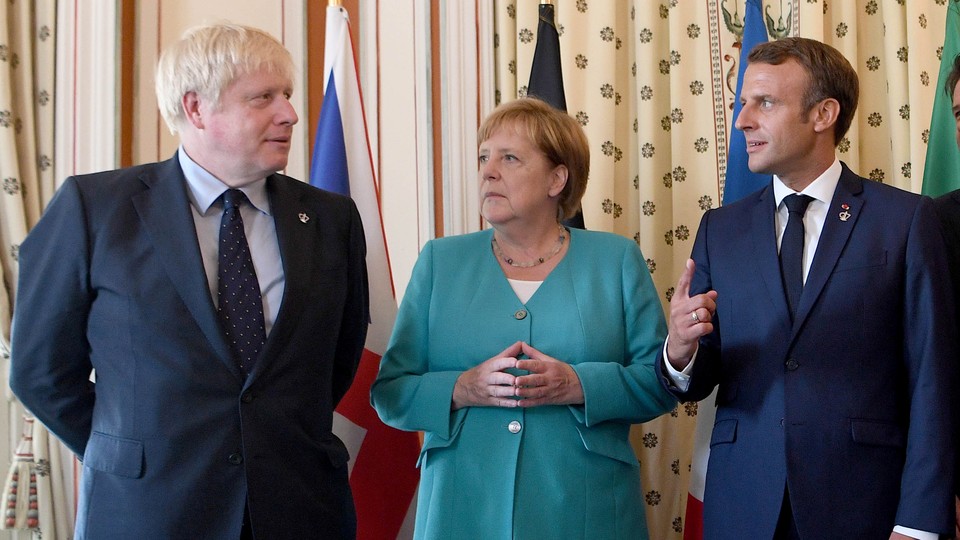 Boris Johnson, Angela Merkel, and Emmanuel Macron stare uneasily at one another.