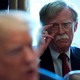 John Bolton stares at Donald Trump during a Cabinet meeting.