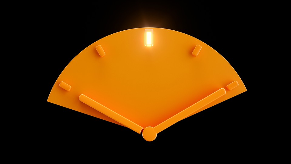 An orange clock face with a light on at noon