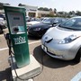 An electric vehicle at a Whole Foods–branded charging station
