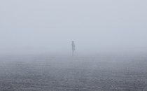 A woman walking in the mist