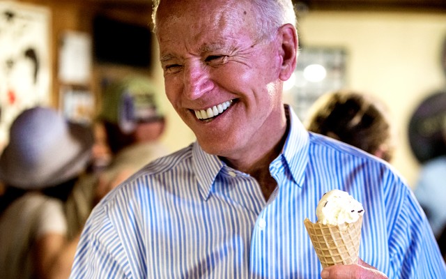 Biden grinning as he holds an ice-cream cone