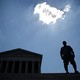 A man stands outside the U.S. Supreme Court after the Court ruling on June 27.