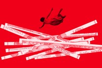 a woman plummeting into a pile of shredded U.S. currency