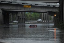 An abandoned Hummer is covered in floodwaters on Interstate 610 after Hurricane Harvey inundated the Texas Gulf coast with rain.