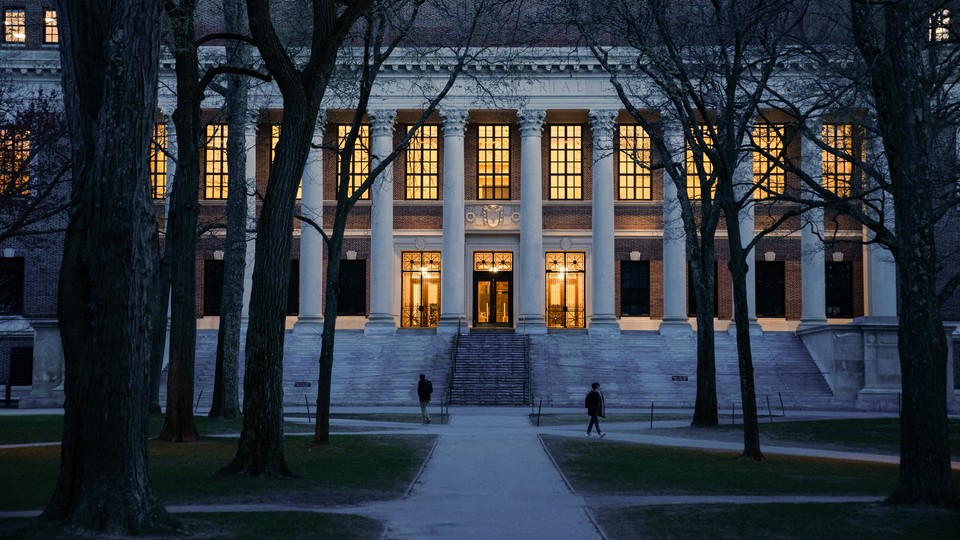 Pedestrians walk through Harvard Yard on the Harvard University campus in Cambridge, Massachusetts, US, on Wednesday, April 16, 2025.