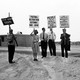 A black-and-white photo of antinuclear protesters holding signs in Cape Canaveral, Florida