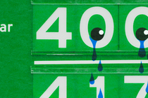 An illustration of a gas-station sign with tears falling from the price numbers