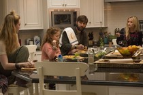 A screenshot of "Big Little Lies" featuring the actress Reese Witherspoon and her characters' husband and children.