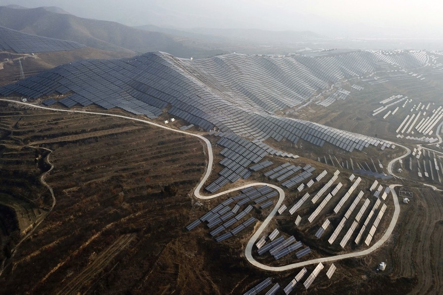 A solar-panel installation covers most of a hillside.