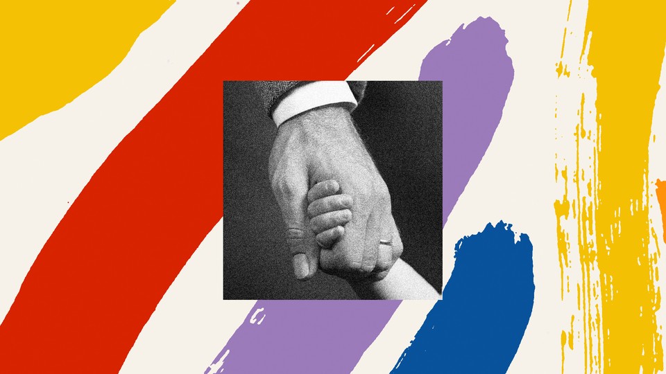 Adult hand holding a child's hand