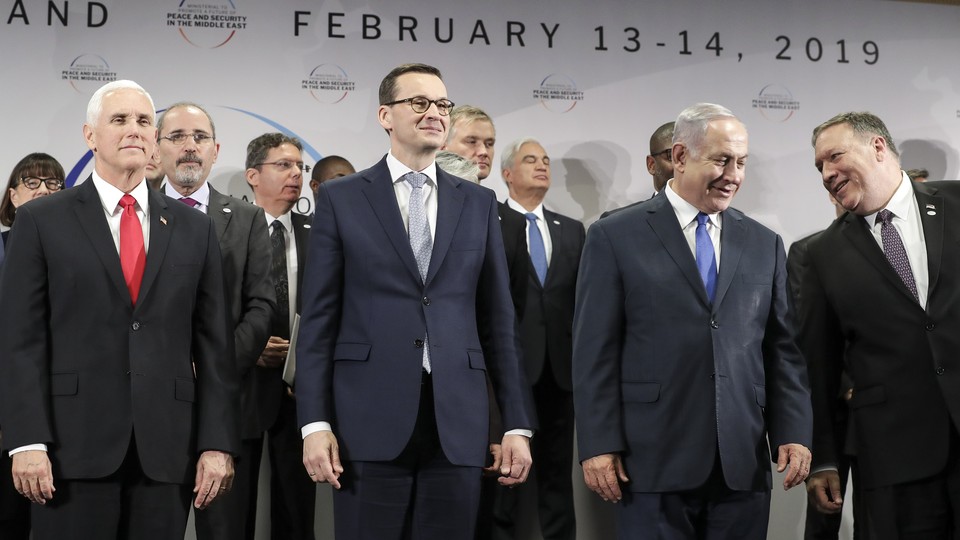 Mike Pence, Polish Prime Minister Mateusz Morawiecki, Israeli Prime Minister Benjamin Netanyahu, and U.S. Secretary of State Mike Pompeo pose for a photo at the Warsaw conference.