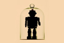 A humanoid robot inside a bell jar