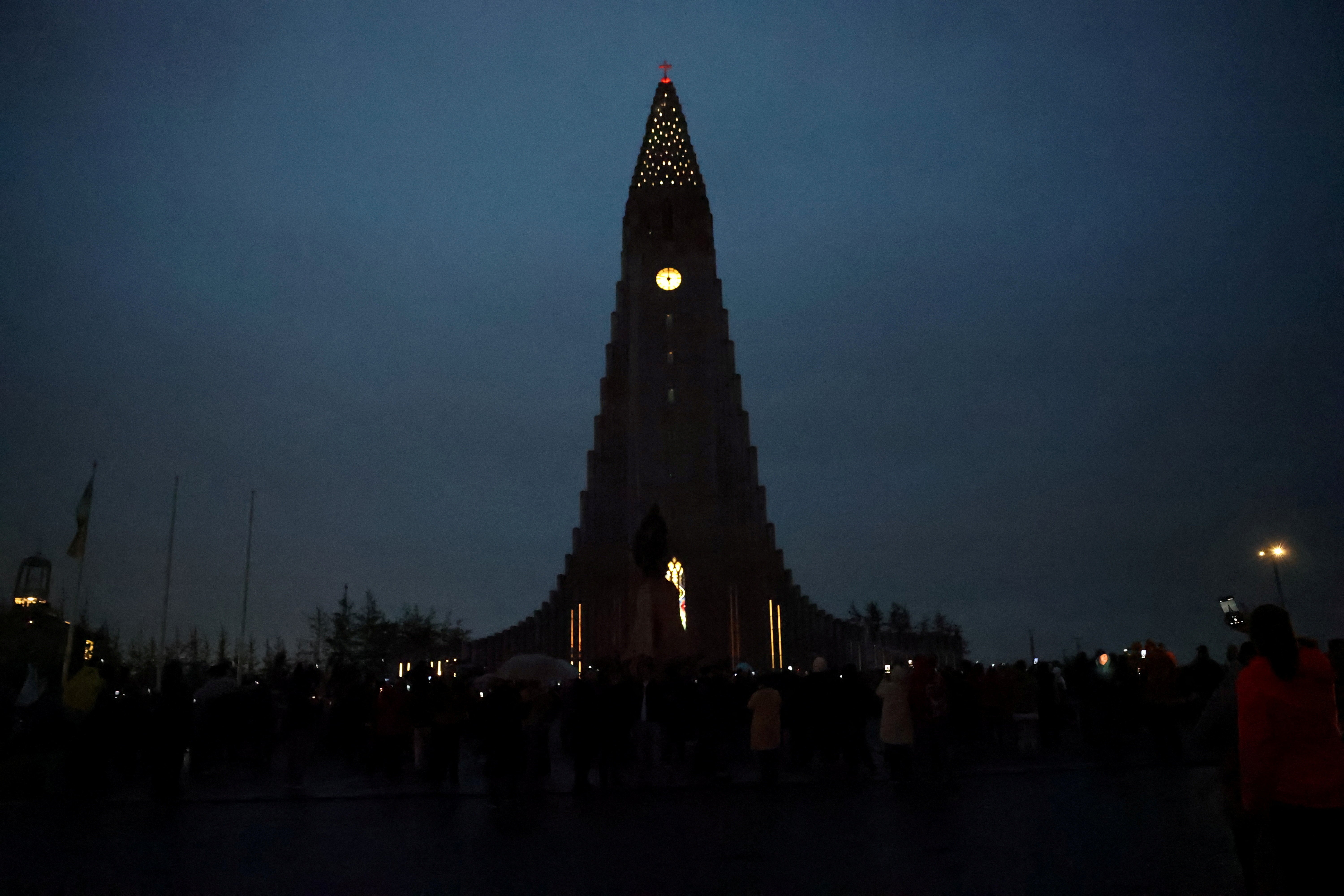 A famous church tower in Iceland, seen under a dark, cloudy sky