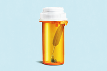 A quill inside a pill bottle