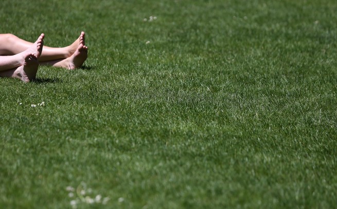 Feet laying in the grass